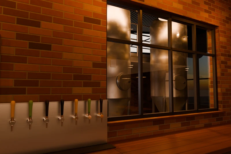A brick taproom wall with a row of tap handles beside a large window onto the stainless fermenting tanks.