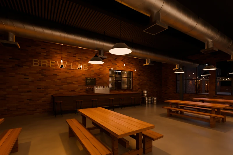 The Brew Lab taproom: brick walls, warm pendant lights, long wooden tables, and a stainless tap wall under a chalkboard menu.